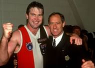 Danny Frawley of the Saints celebrates with coach Stan Alves after a AFL match between the St Kilda Saints and the Carlton Blues